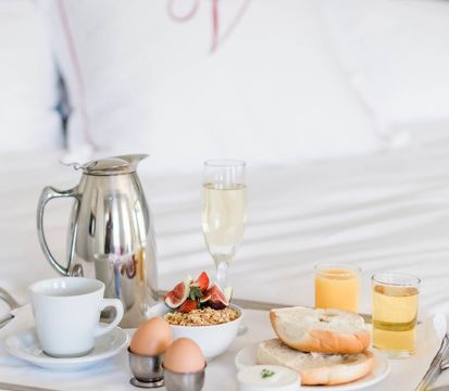 A Table With Food And Drinks On It