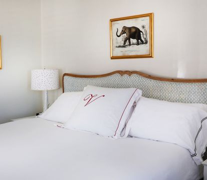 A Bed With White Sheets