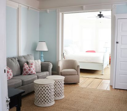 A Living Room With A Couch And A Table