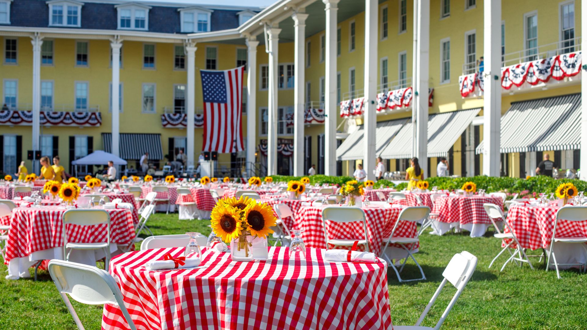 A Group Of Tables And Chairs Outside