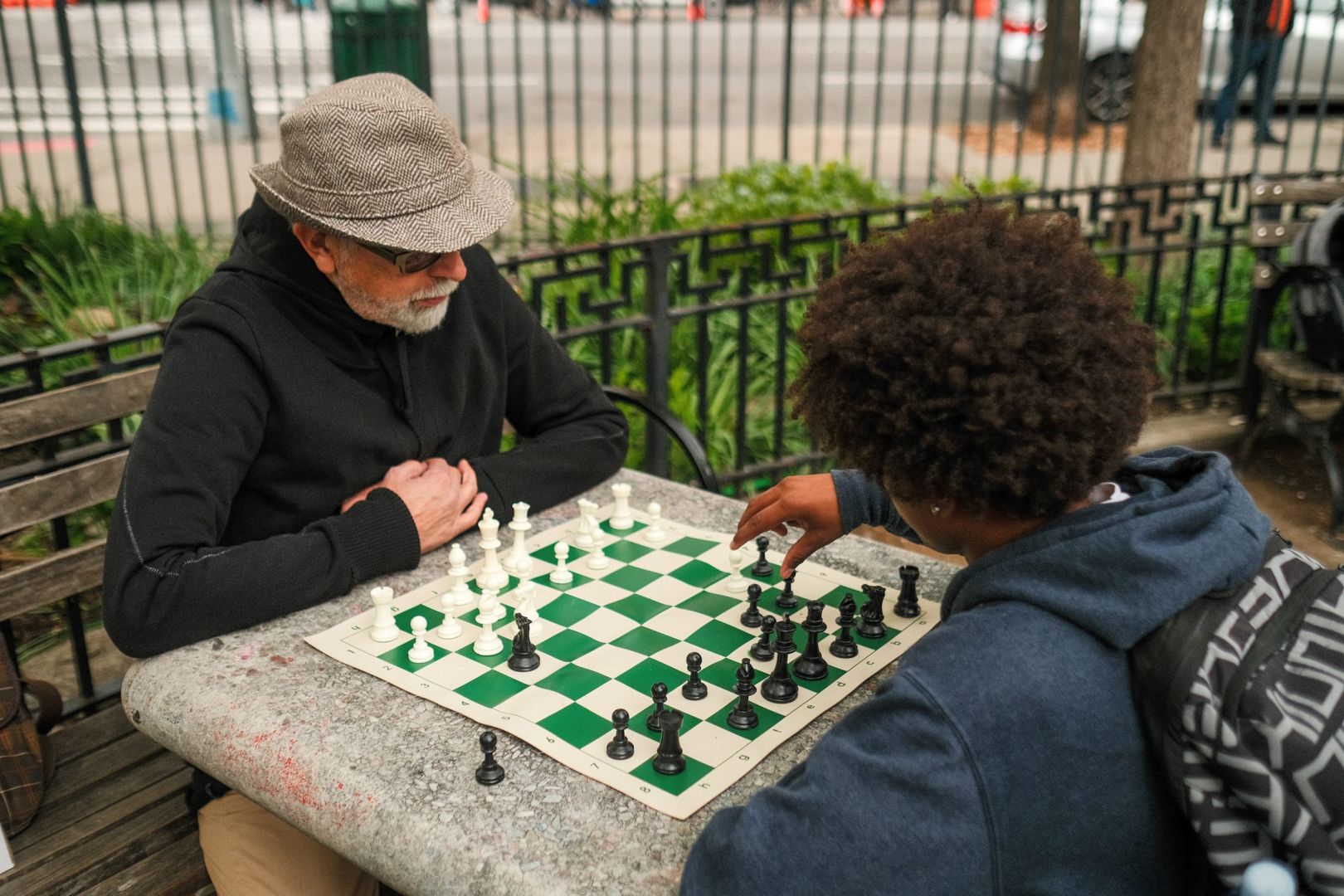 A Man And Woman Playing A Board Game