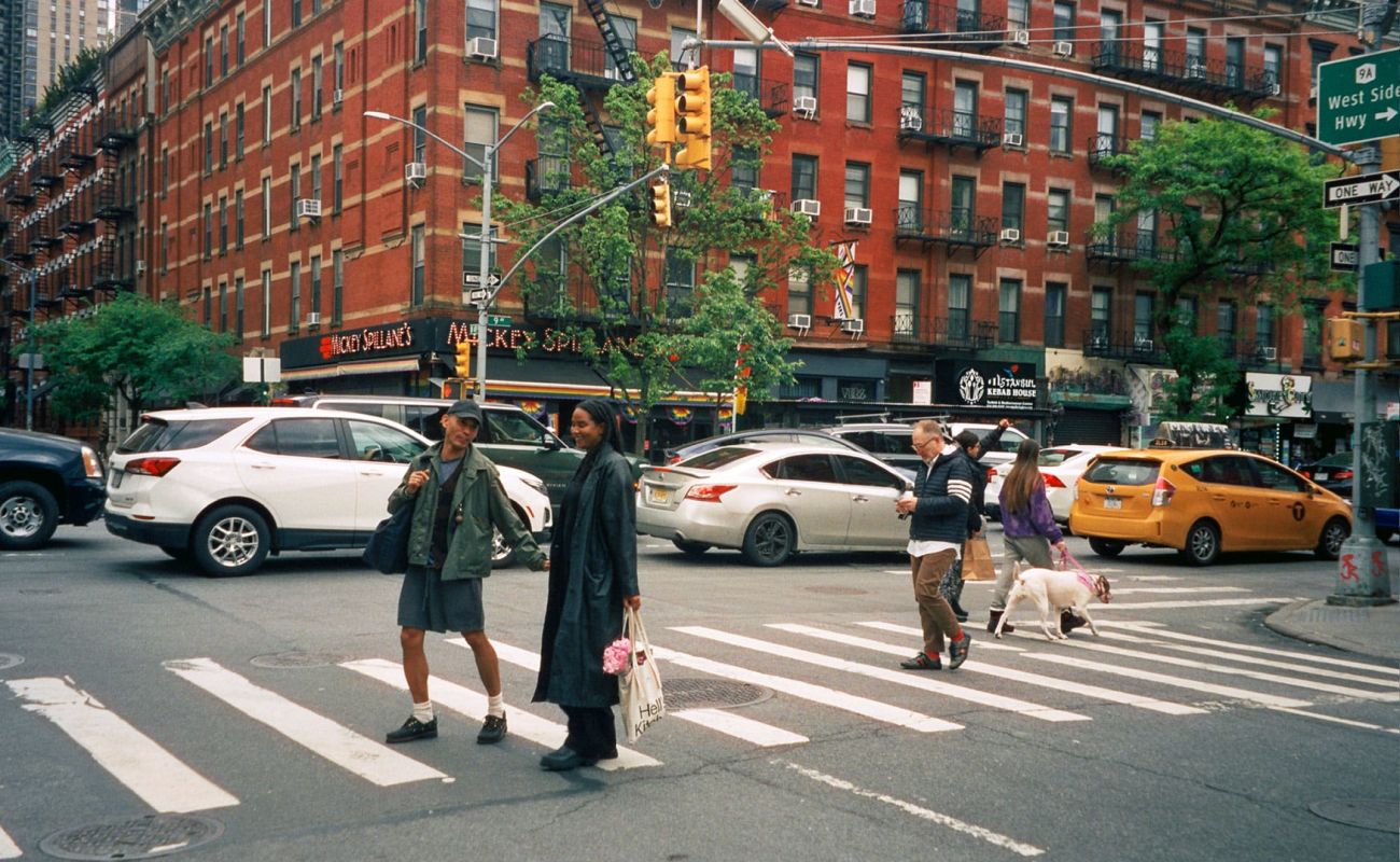 A Group Of People Crossing A Street