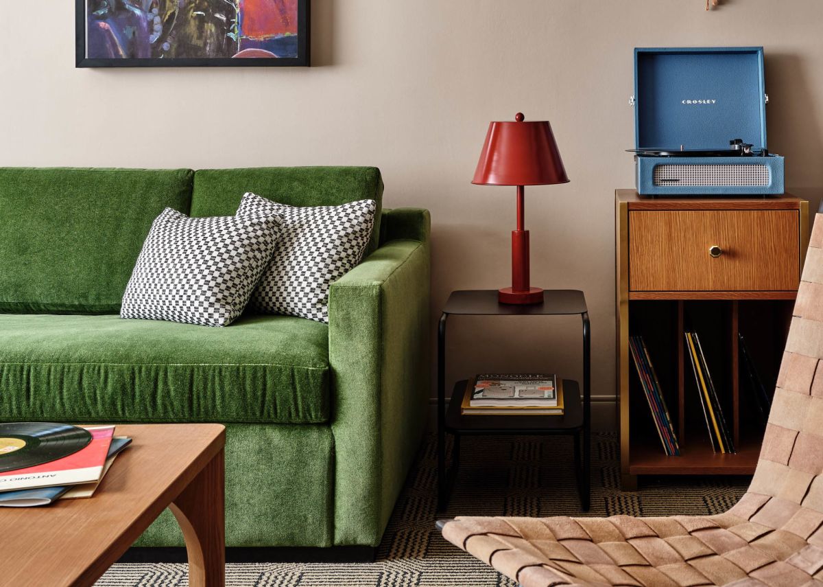 A Living Room With Green Couches