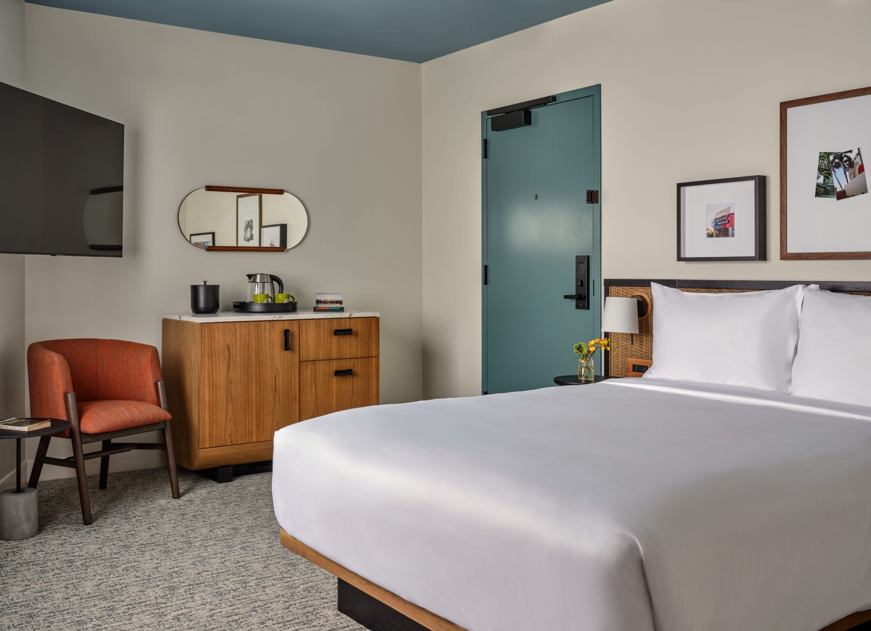 A Bedroom With A Bed And A Chair