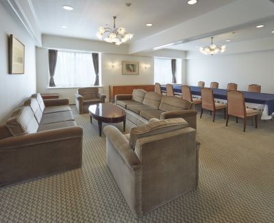 A Large Room With A Couch And Chairs