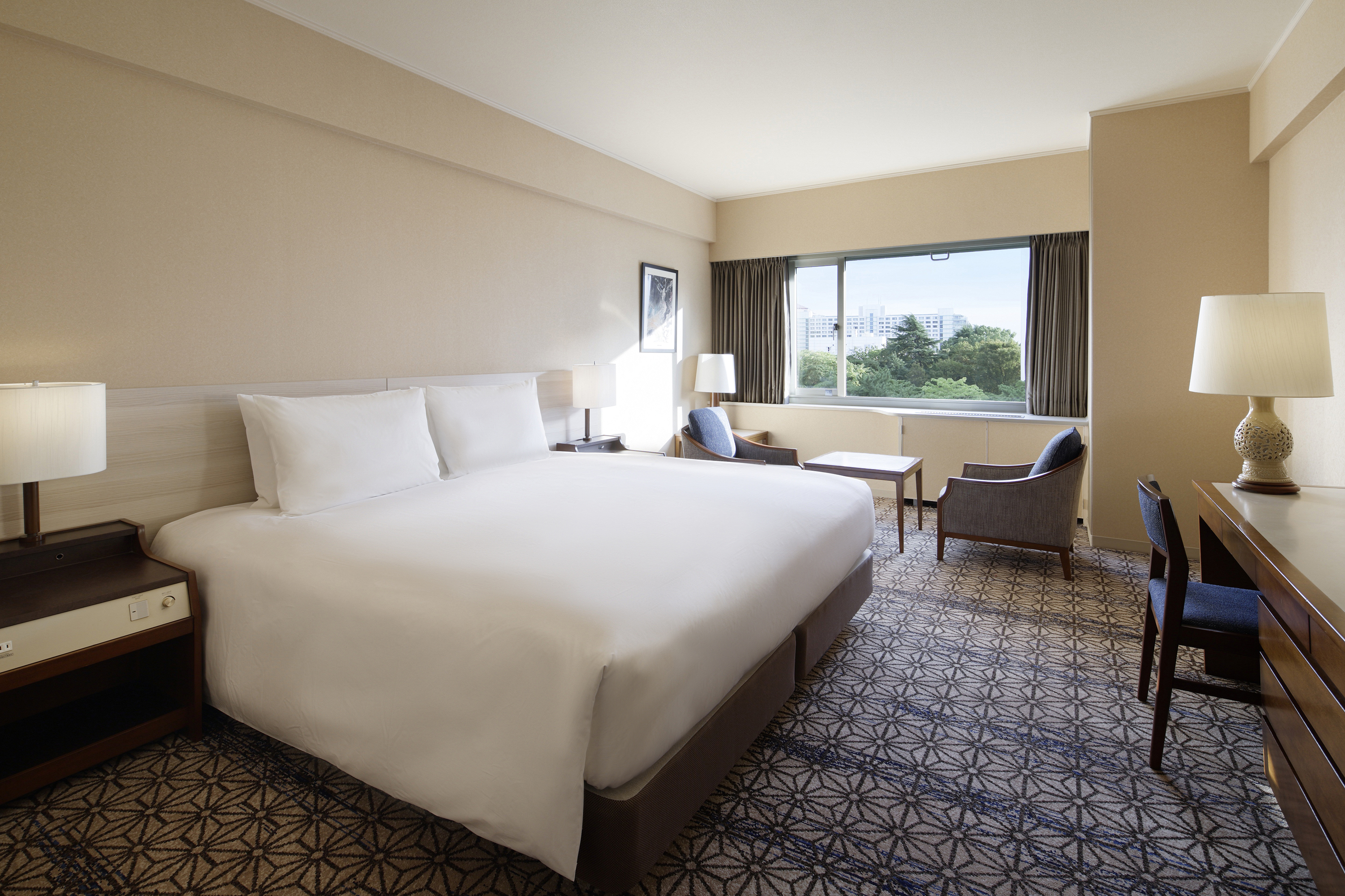 A Bedroom With A Large Bed