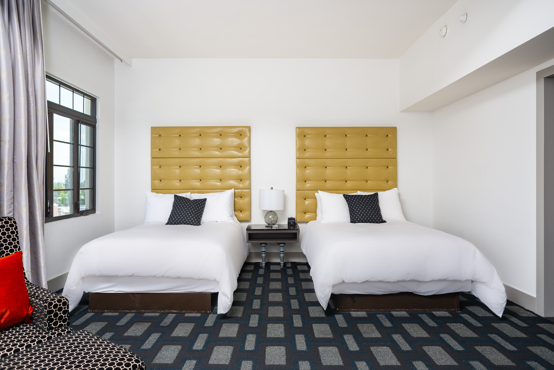 A Couple Of Beds In A Room