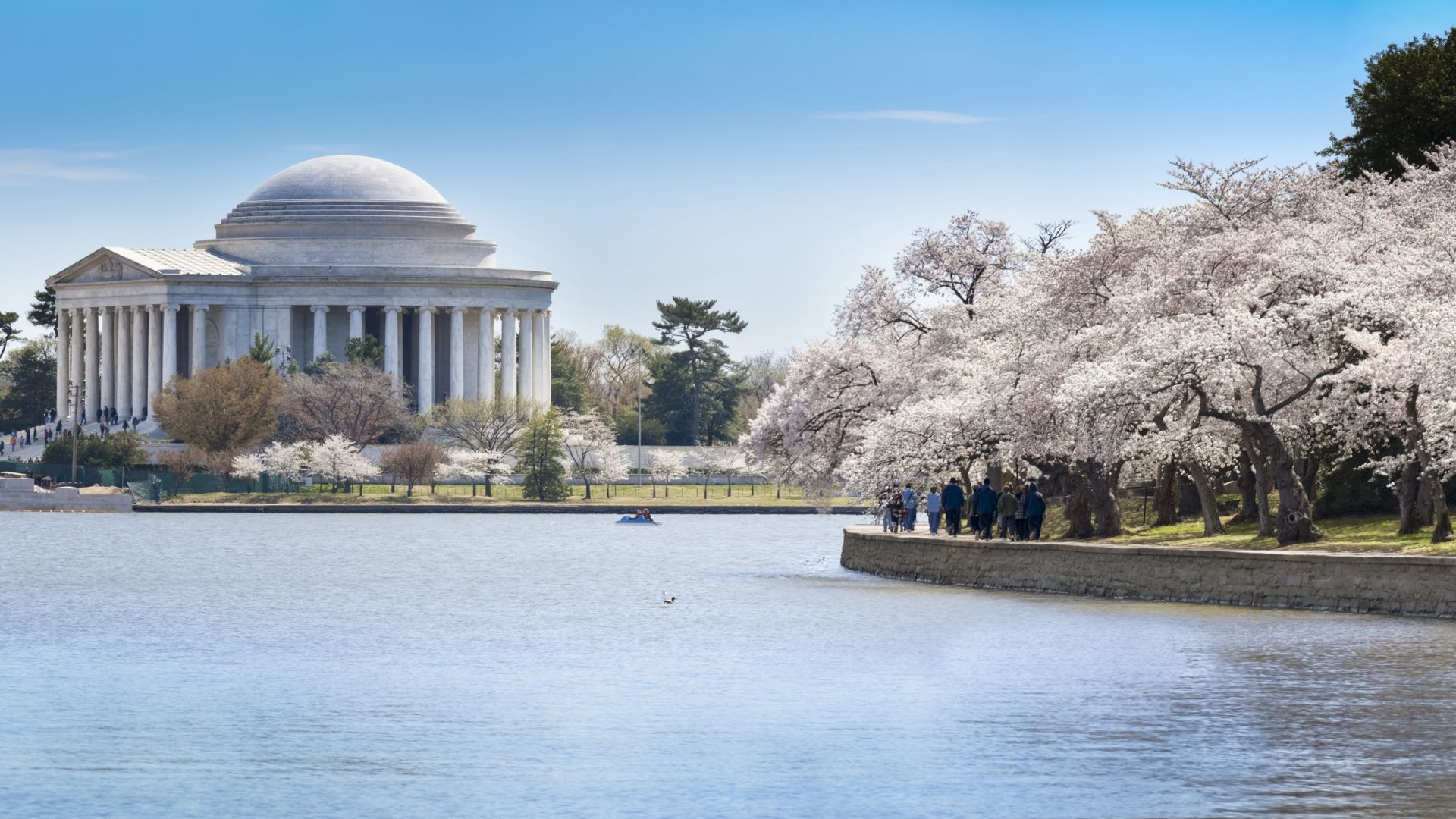 A Body Of Water With Jefferson Memorial In The Background
