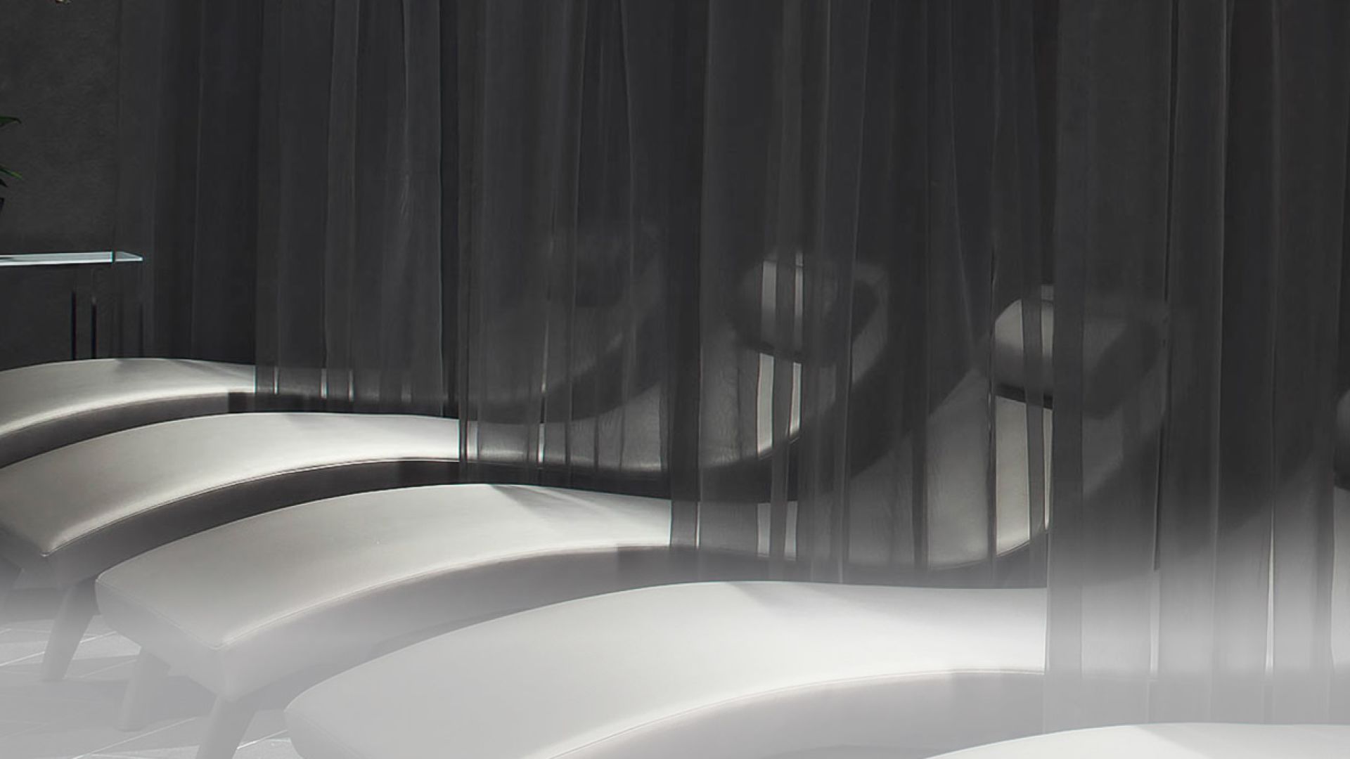 A White Bathtub With A Black Curtain
