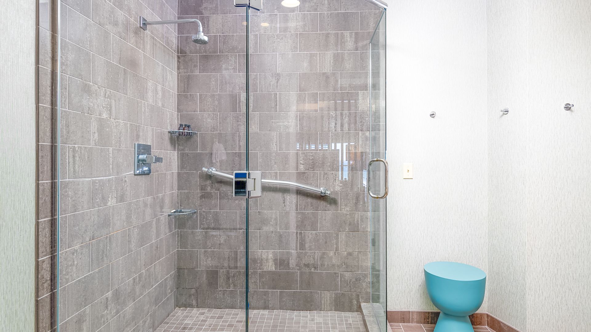 A Shower With A Glass Door