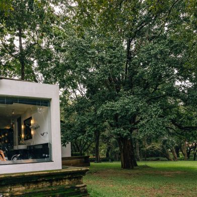 A Small House With A Tree In The Front